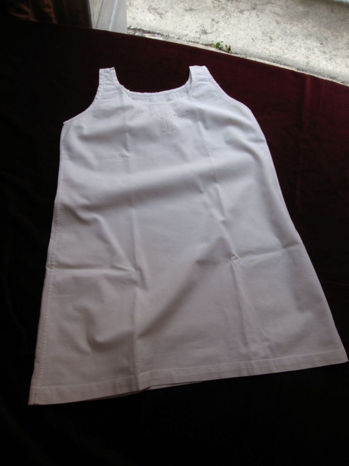 Two white cotton child's gowns