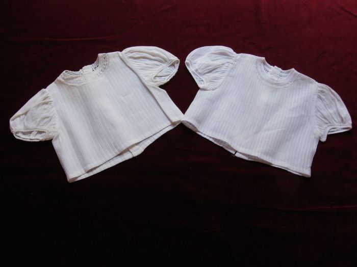 Pair of white cotton newborn blouses