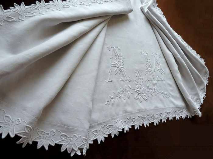 Antique quality embroidered linen sheet monogrammed AM.