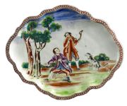 A CHINESE EXPORT SCALLOPED OVAL STAND
CIRCA 1785
