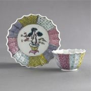 A CHINESE EXPORT FAMILLE-ROSE FLUTED TEABOWL AND SAUCER
CIRCA 1735-40
