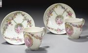 A PAIR OF 18TH CENTURY CONTINENTAL SOFT-PASTE PORCELAIN CUPS AND SAUCERS